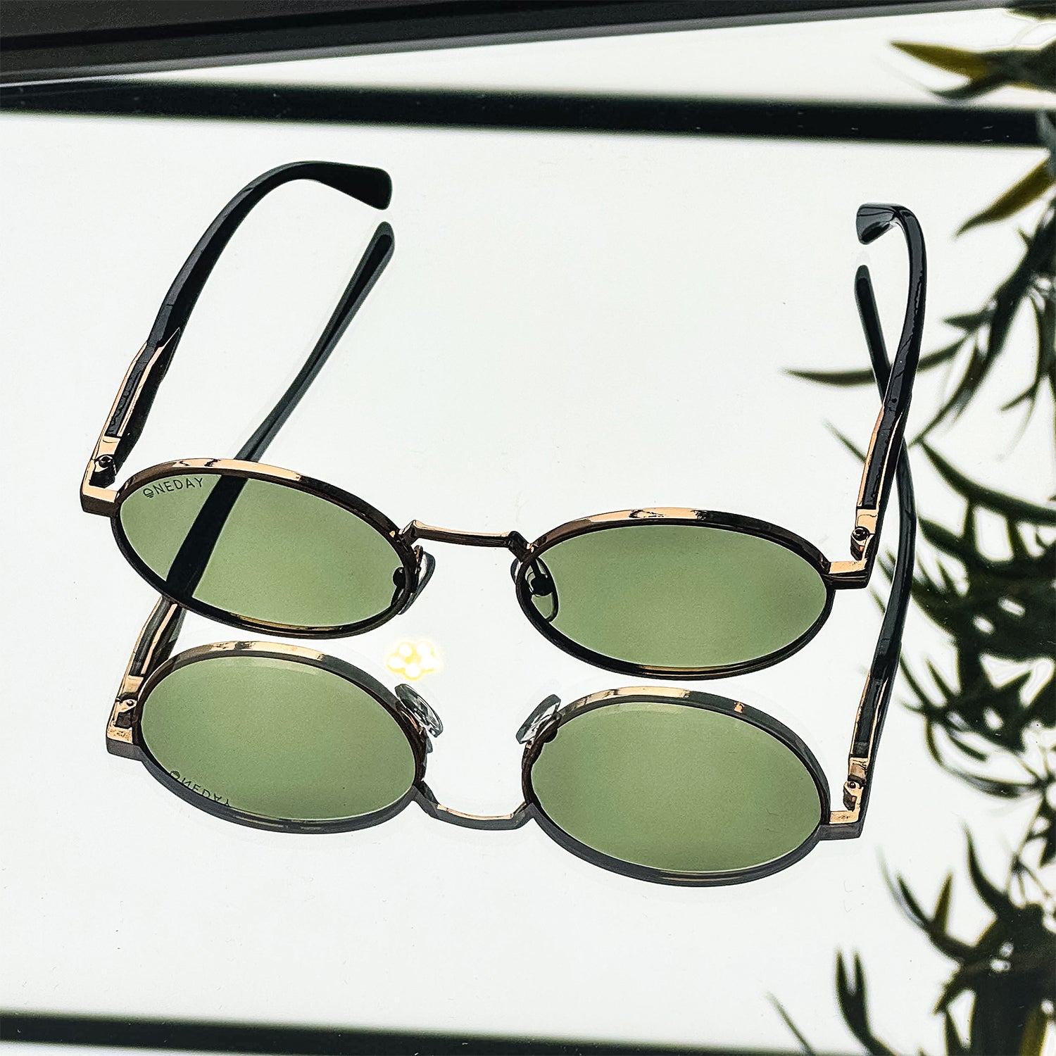 ONEDAY round sunglasses on a mirror
