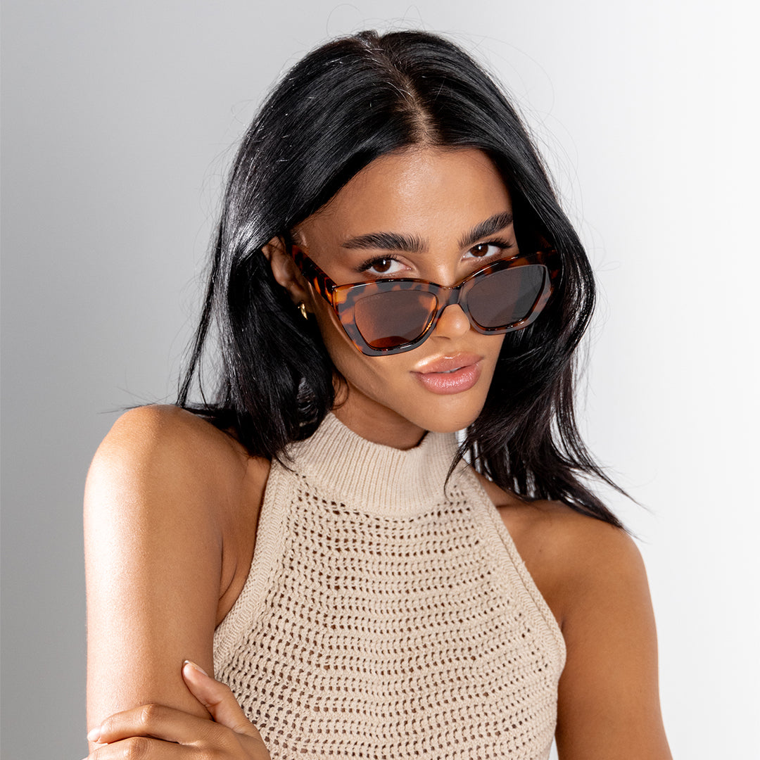 Winona Tortoise Brown Cats Eye Women's Sunglasses on brunette model looking down