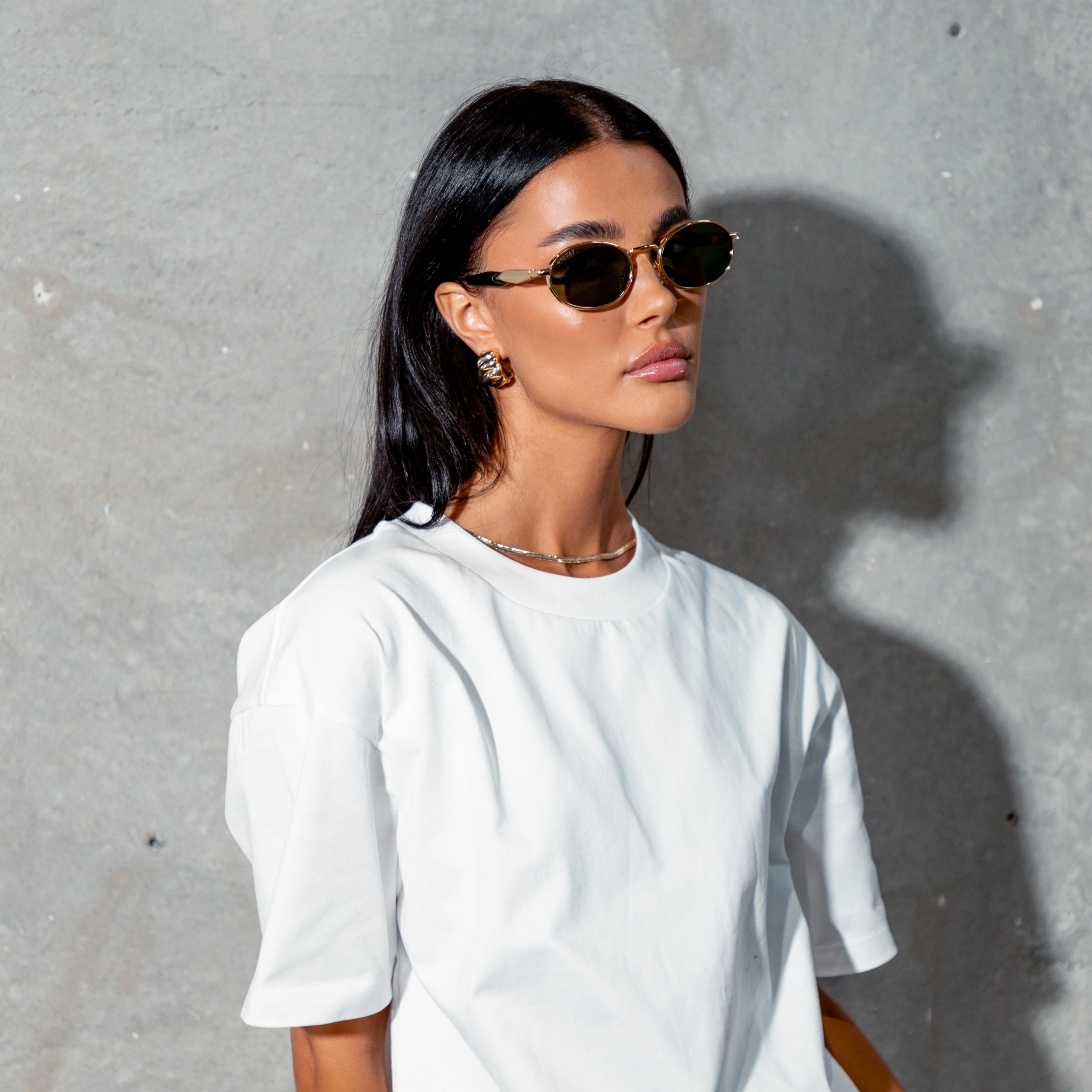 Female model wearing round metal ONEDAY sunglasses
