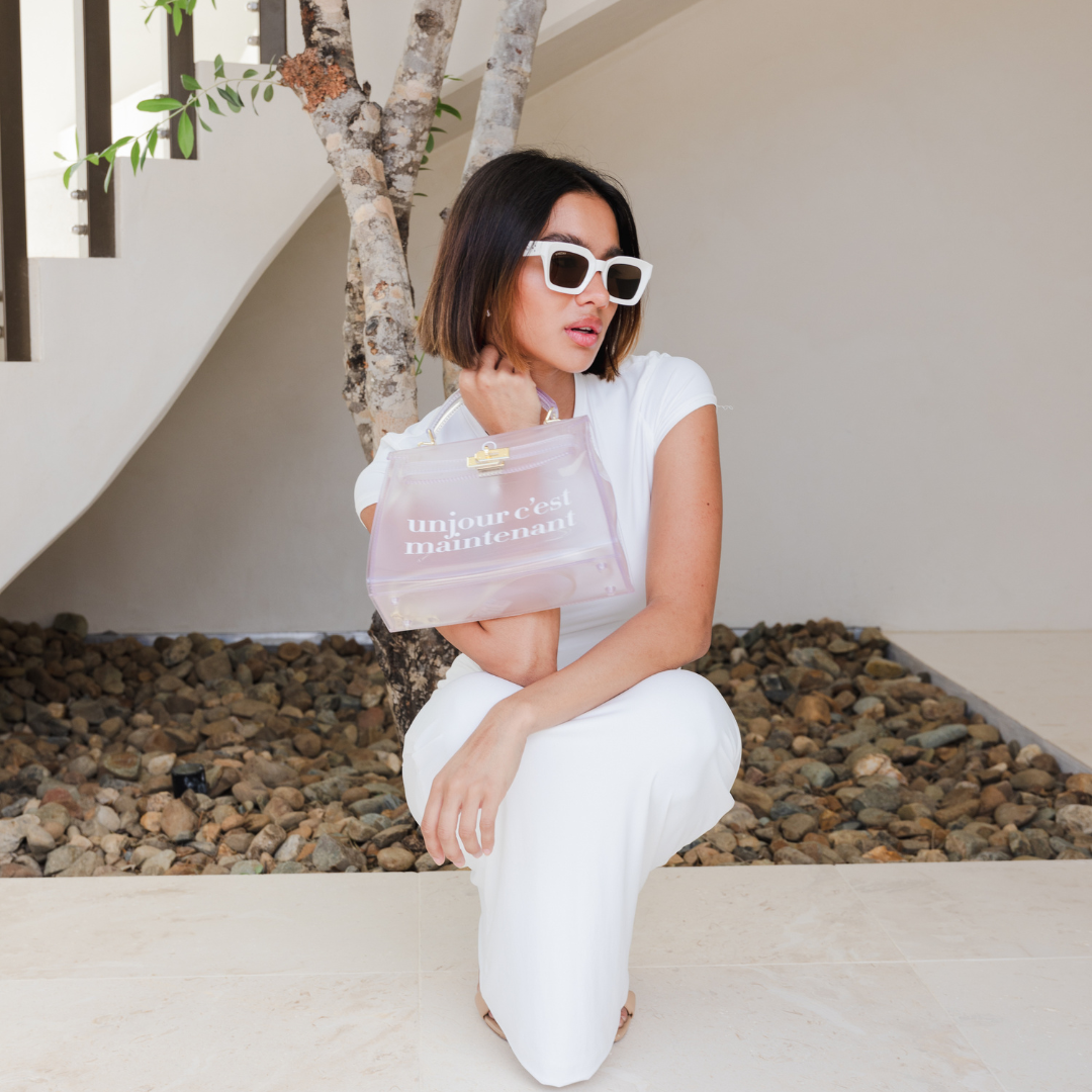 Female model wearing Below Deck - Cream Brown while holding a Oneday bag