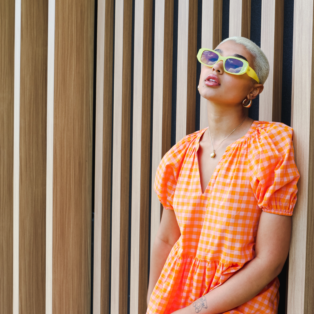Female model wearing Bejewelled - Yellow Brown while looking up