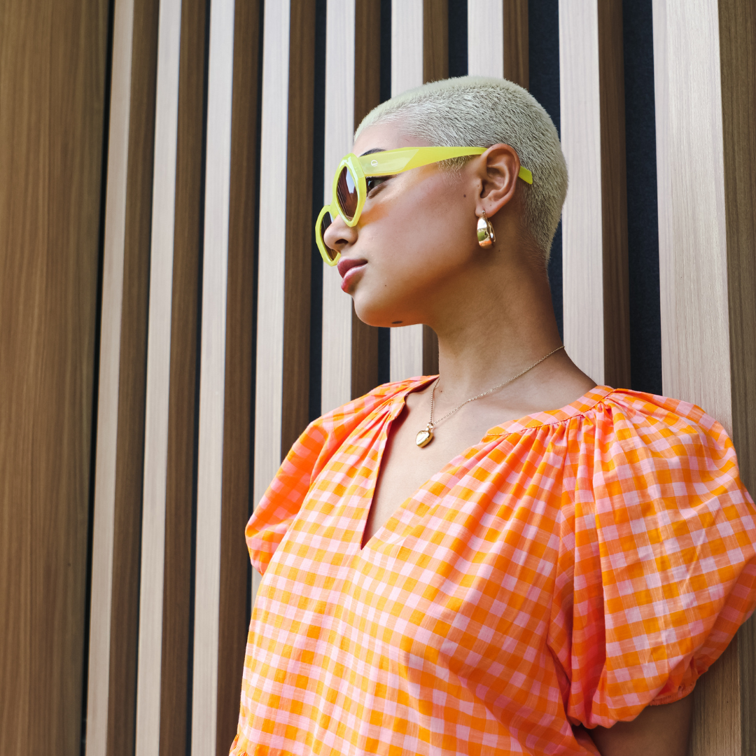 Side view of a female model wearing Bejewelled - Yellow Brown