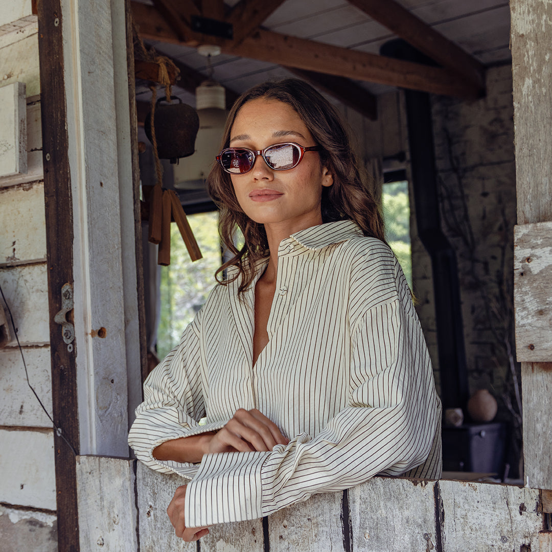 Female model wearing Oneday Australia's Montana Sunglasses, Oval Brown frame with brown lenses. 