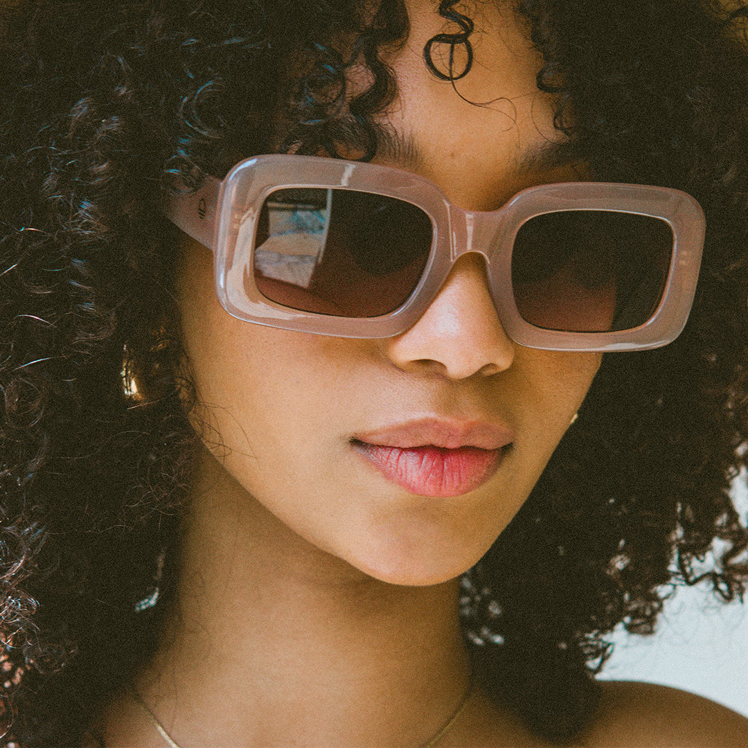 Holiday Brown Rectangle Womens Sunglasses made of polycarbonate and brown lens on model close up