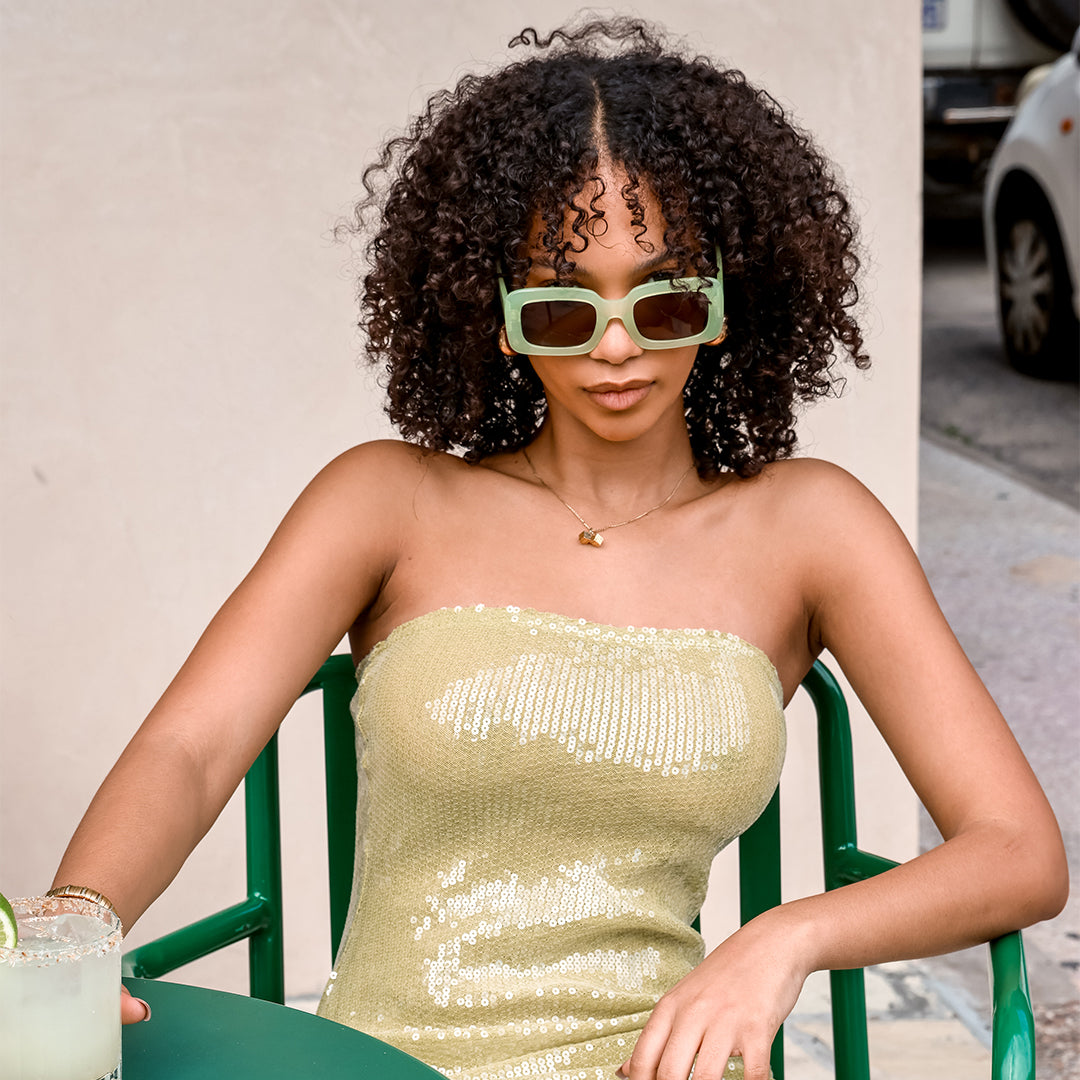 Holiday Green Rectangle Womens Sunglasses made of polycarbonate and G15 lens on model with margarita in hand