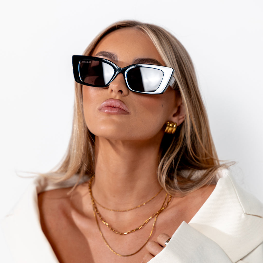 Juniper Black Smoke Rectangle Women's Sunglasses on model looking up