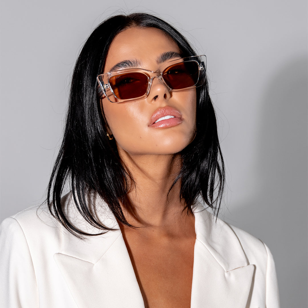 Juniper Crystal Clear Brown Rectangle Women's Sunglasses on model looking up