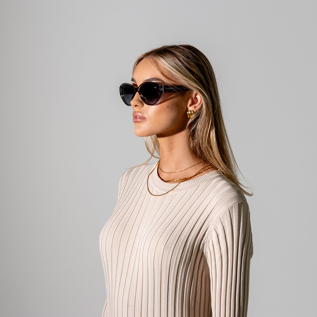 Polly Black Smoke Polarised Sunglasses on model looking to the side