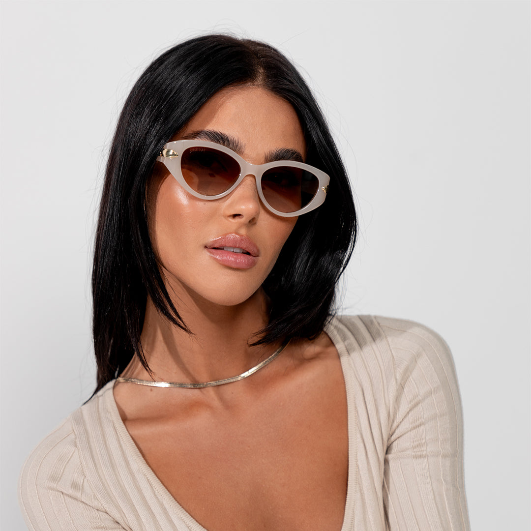 Sofia Cream White Brown Oval Women's Sunglasses on model looking at camera