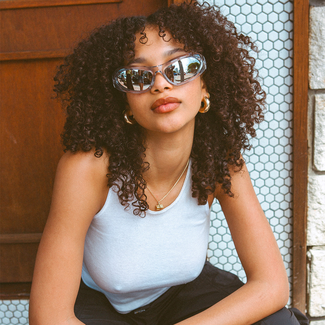 Styler Silver Wrap Around Womens Sunglasses made of polycarbonate and silver lens on model looking at camera
