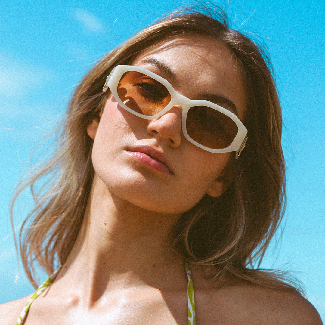 Vogue Cream Angular Womens Sunglasses made of polycarbonate and brown lens on female model looking at the camera