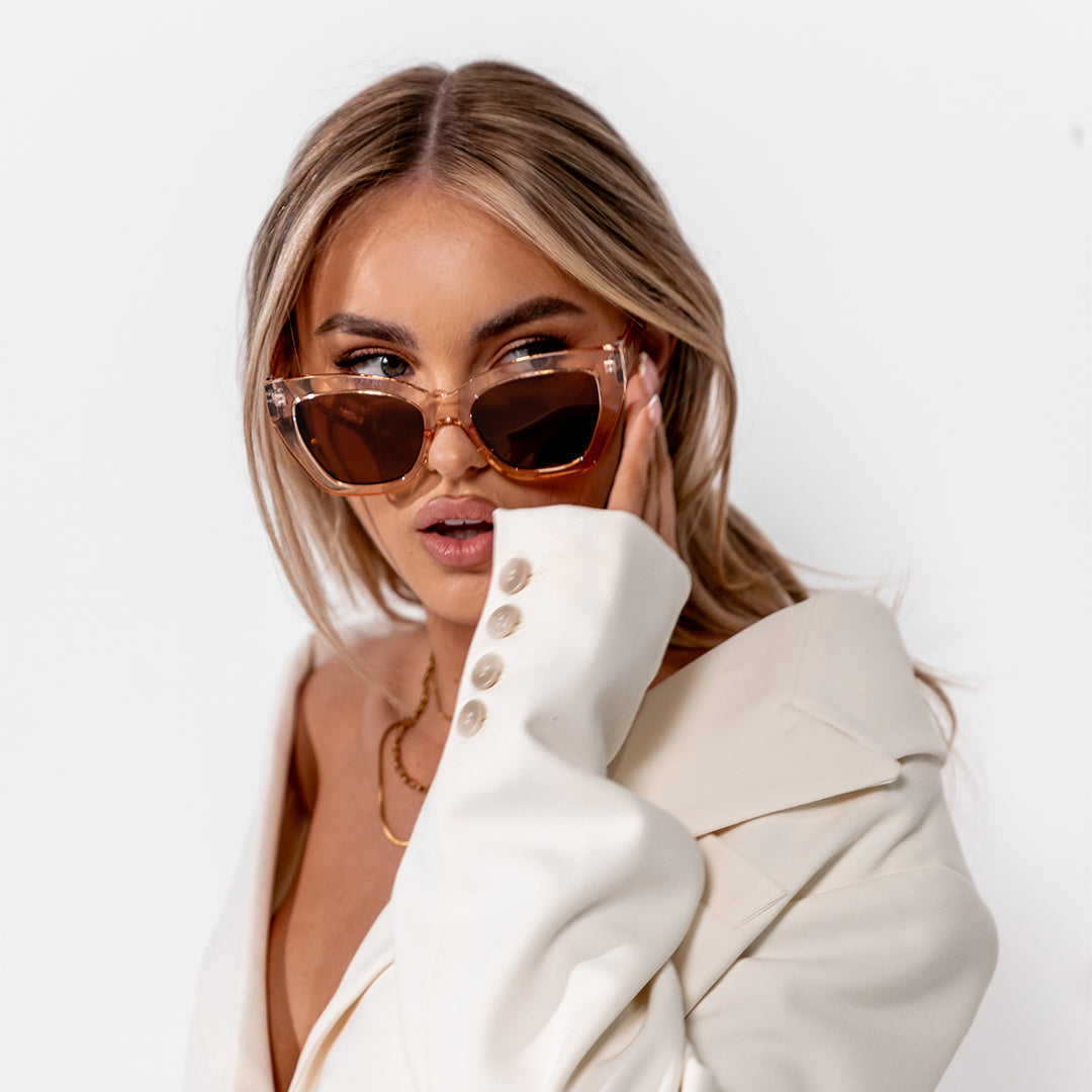 Winona Beige Brown Cats Eye Women's Sunglasses on blonde model looking to the left