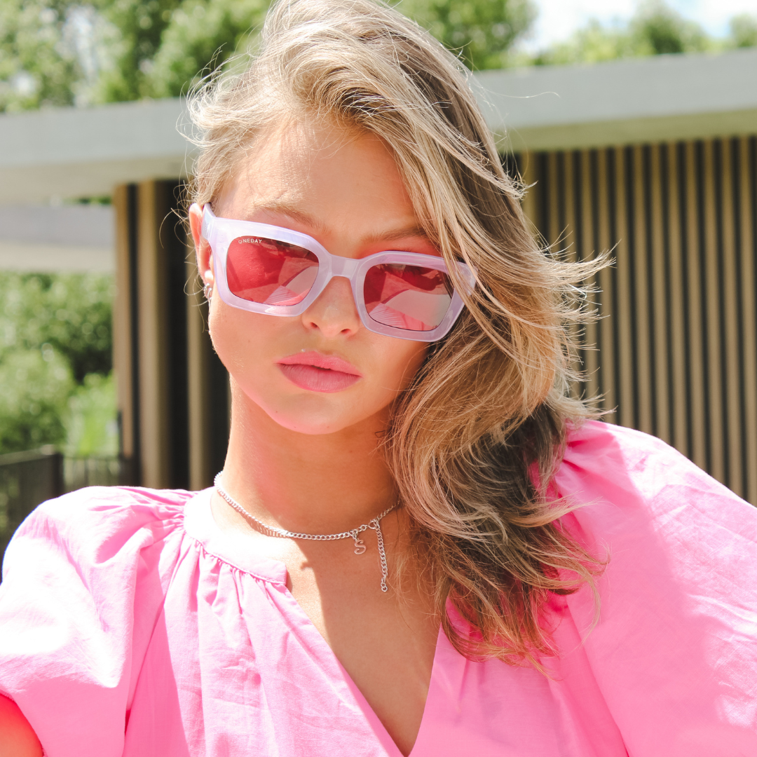 Female model wearing Below Deck - Purple Rose while looking down