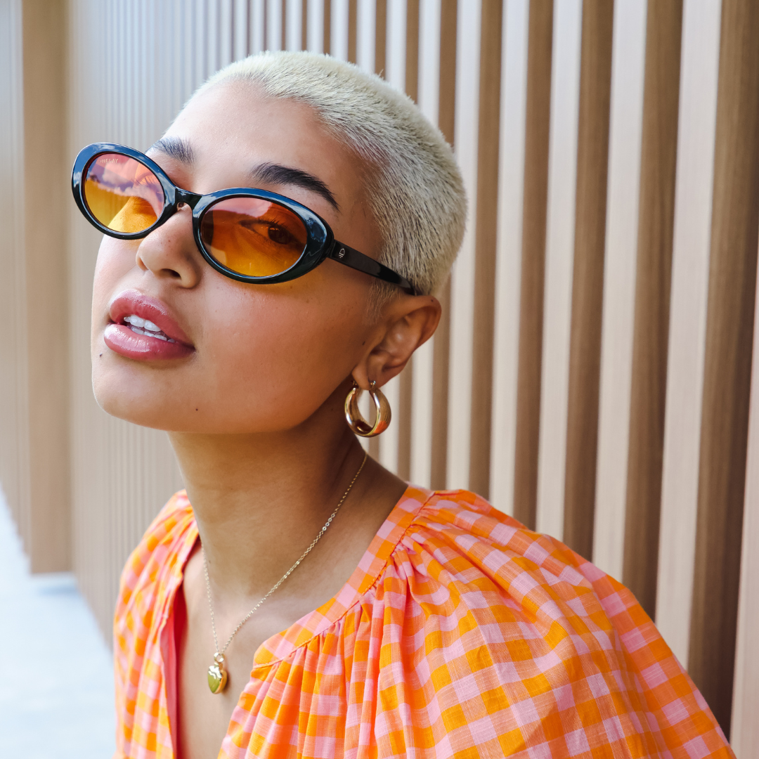 Female model wearing Daisy Chains - Black Orange